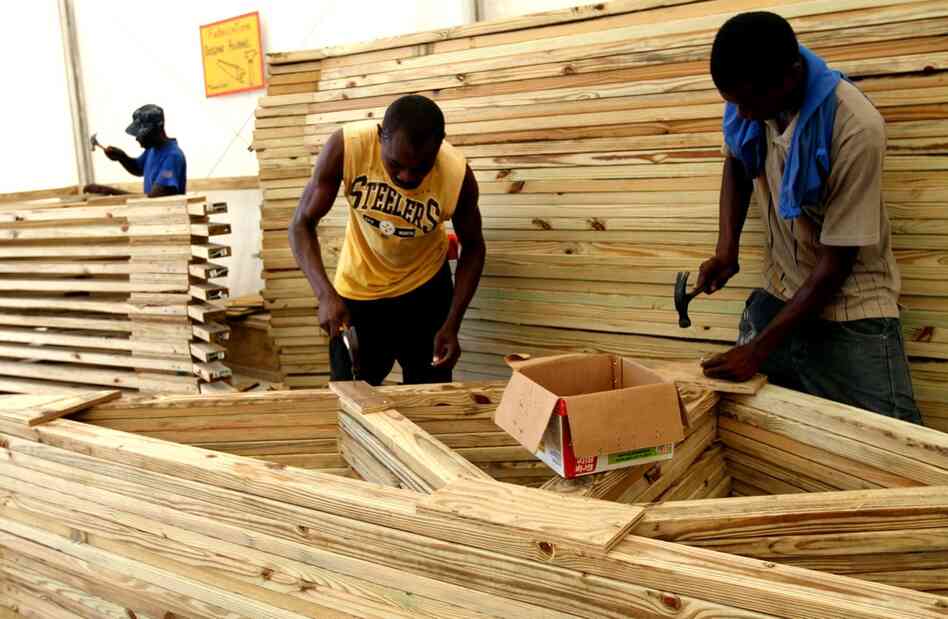 Unlike most current cash-for-work programs in Port-au-Prince, where locals are employed and paid by the hour, Concern Worldwide pays its carpenters according to output.