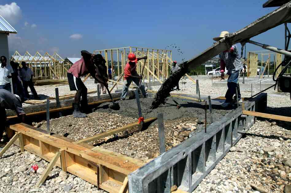 The heavy downpours of Haiti's rainy season are among the biggest threats to the well-being of displaced residents living in camps. New transitional shelters are being built on foot-high slabs of concrete to protect them from rains and floods.