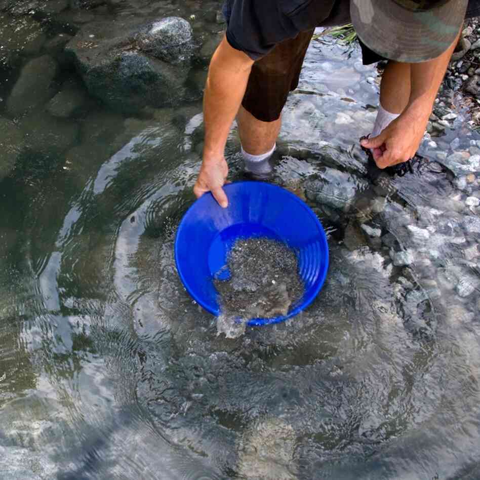 Kevin Brown pans material at "Nugget Alley" in Angeles National Forest, Calif.