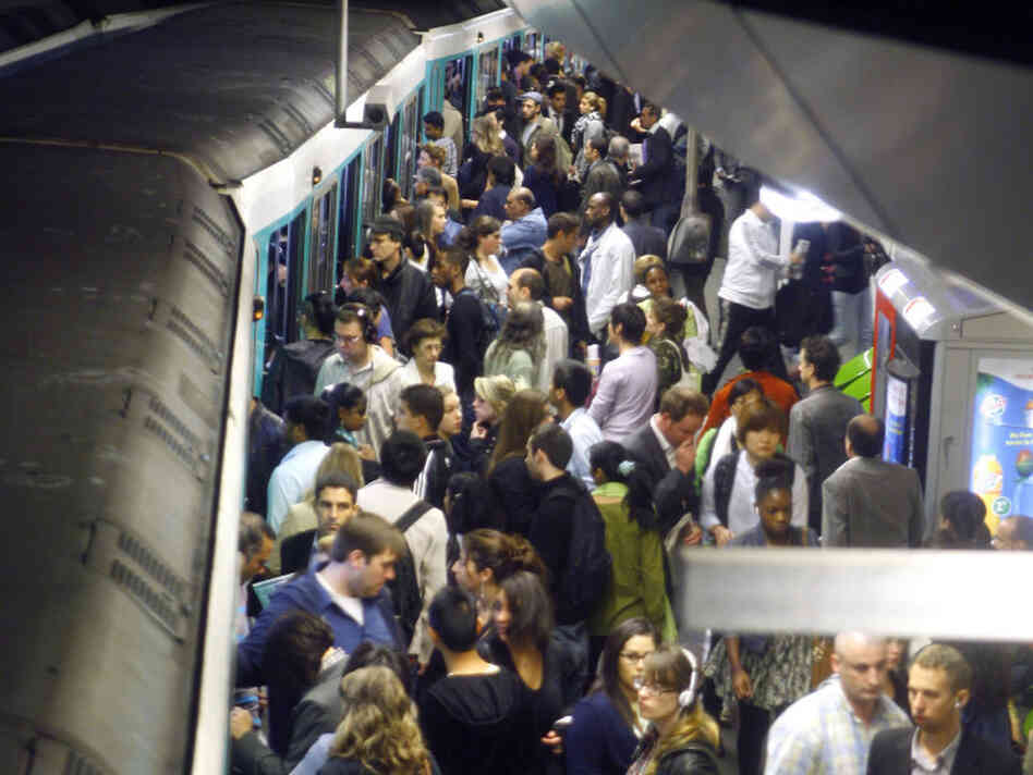 commuters wait for trains in paris commuters wait for trains in paris