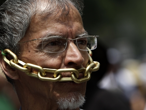 In this Aug. 7 photo, a Mexican journalist protests against the violence against journalists.   