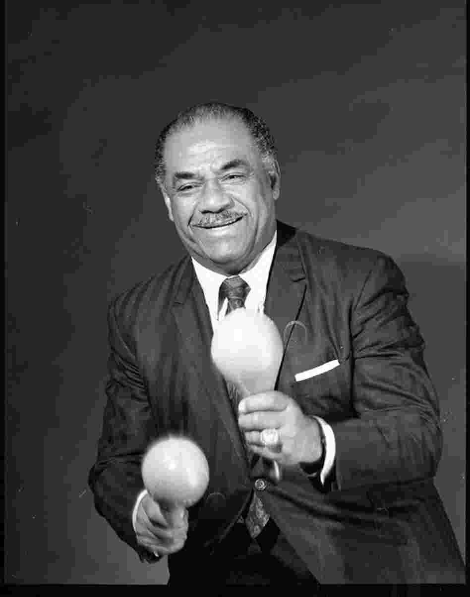 Machito in my basement photo studio/workshop in the 1970s.  Machito liked the plastic maracas that I made because they were loud and he performed in front of a large band.