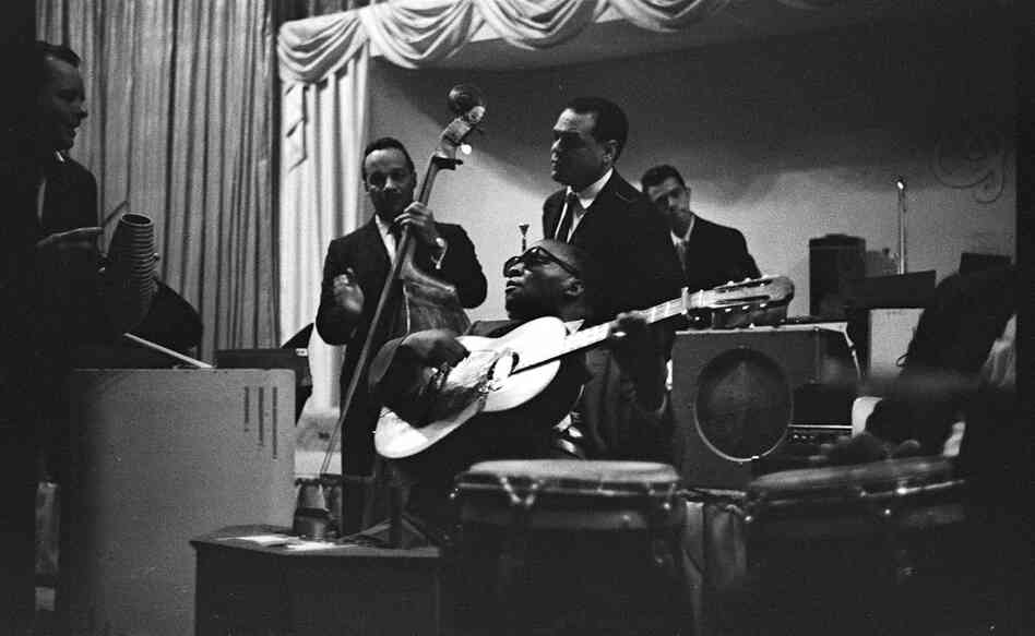 A rare photograph of Afro-Cuban music pioneer Arsenio Rodriguez in a performance in New York City. I took this shot sometime in the 197s.