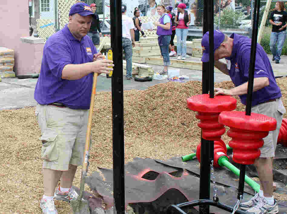 Darell Hammond makes sure supports for a new playground are straight. Darell Hammond makes sure supports for a new playground are straight.