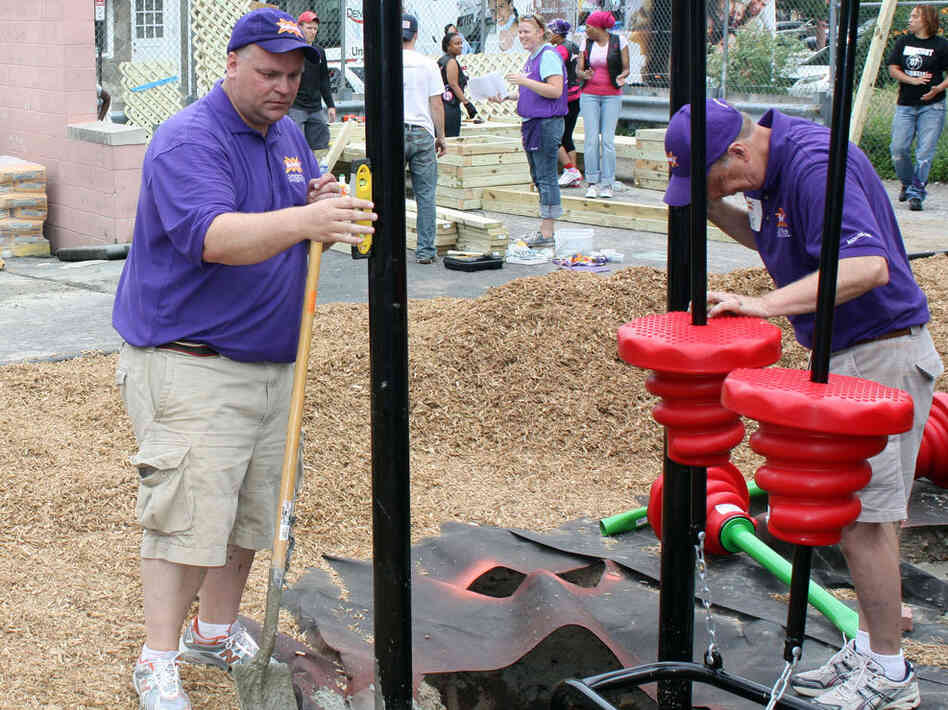 Darell Hammond makes sure supports for a new playground are straight. Darell Hammond makes sure supports for a new playground are straight.
