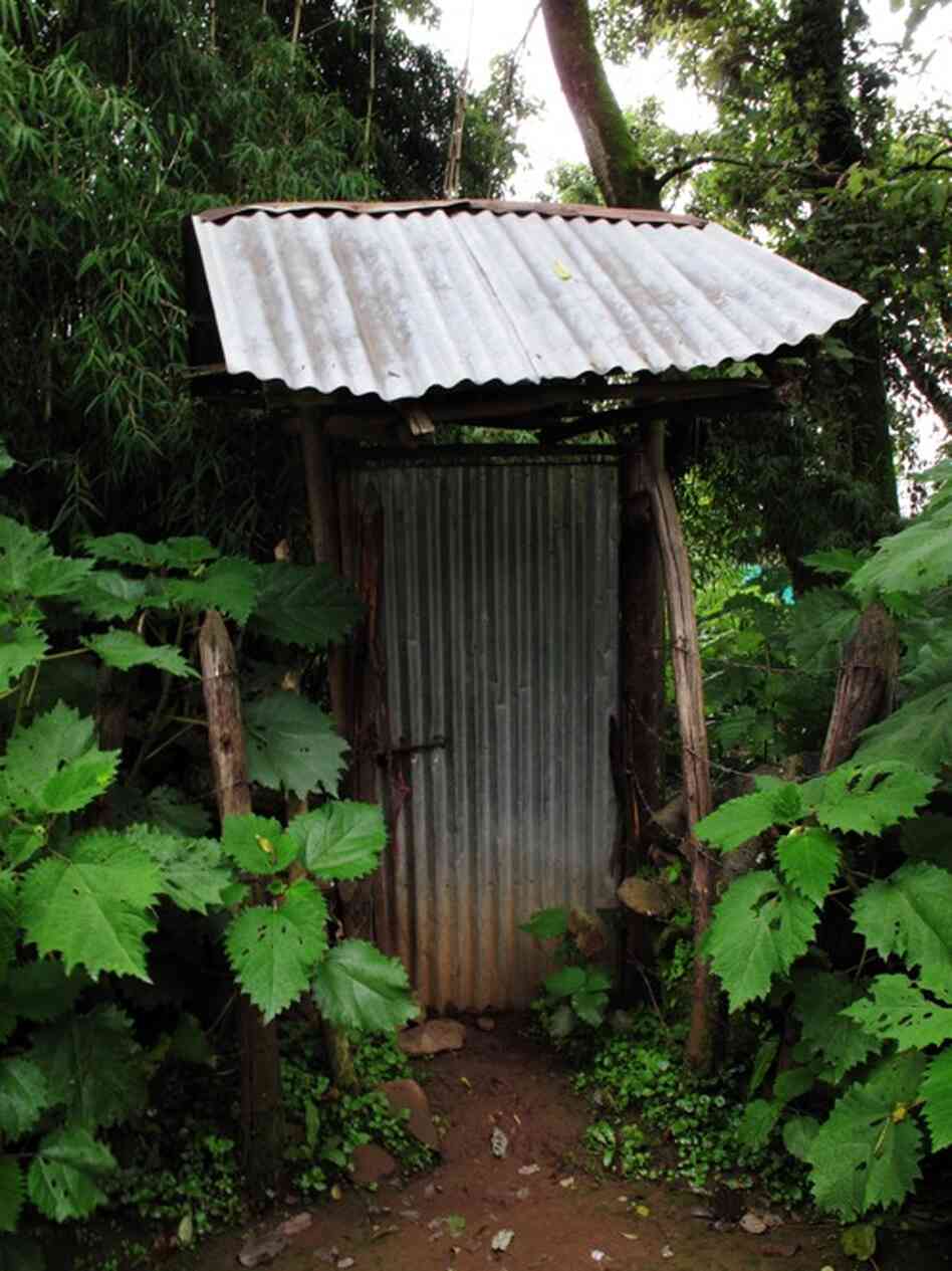 A locked door leads to a garden with a shack built over one of the springs.