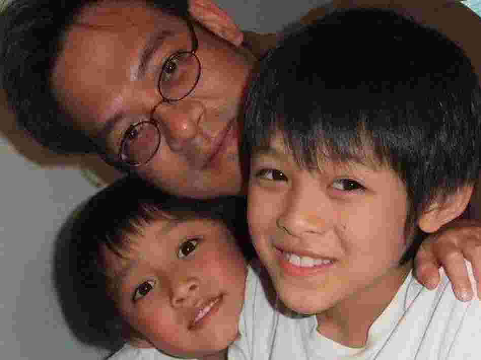 Vincent Young enjoys a moment with his two young sons. Vincent Young enjoys a moment with his two young sons.