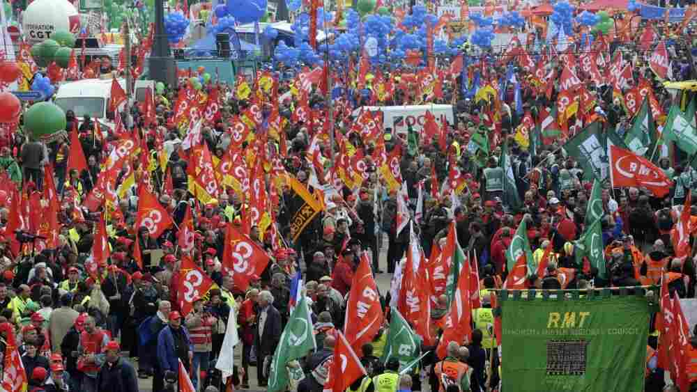 Thousands of demonstrators march down a boulevard in Brussels to protest government austerity plans. Thousands of demonstrators march down a boulevard in Brussels to protest government austerity plans.