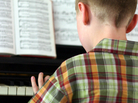 A boy plays piano A boy plays piano