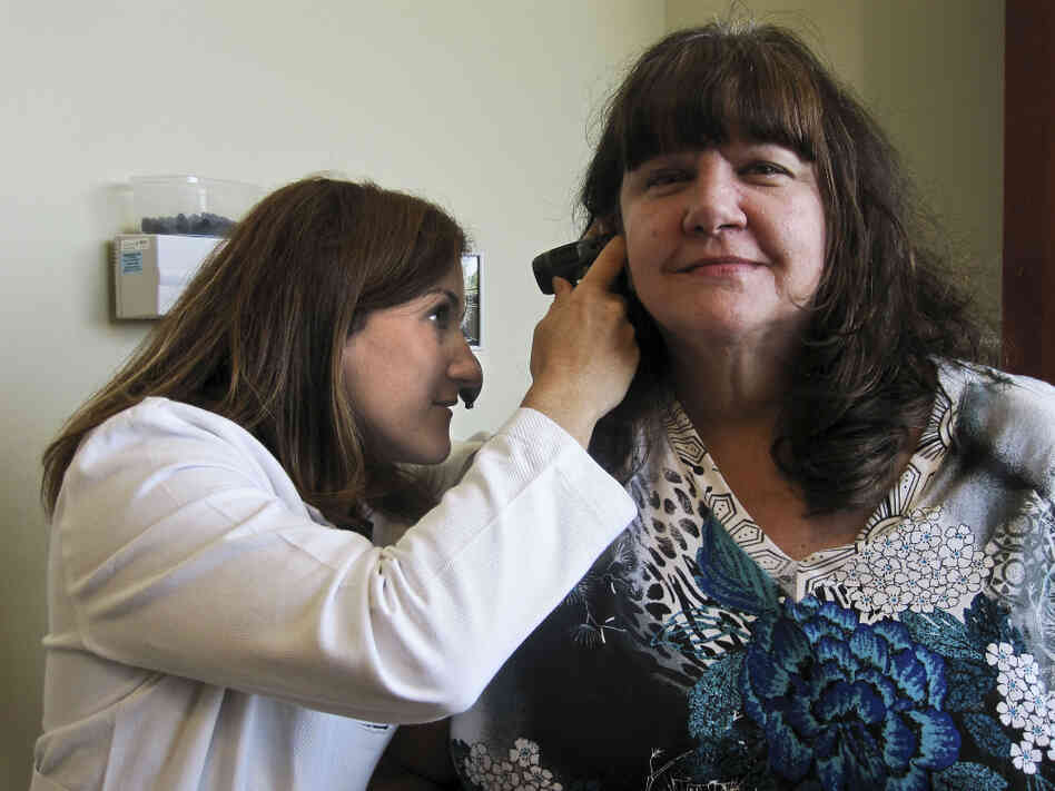 Dr. Michele Roberts Casey examines a Patient Dr. Michele Roberts Casey examines a Patient