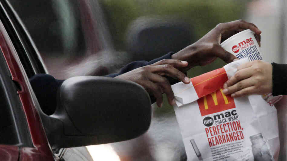 customer gets fries at McDonalds customer gets fries at McDonalds