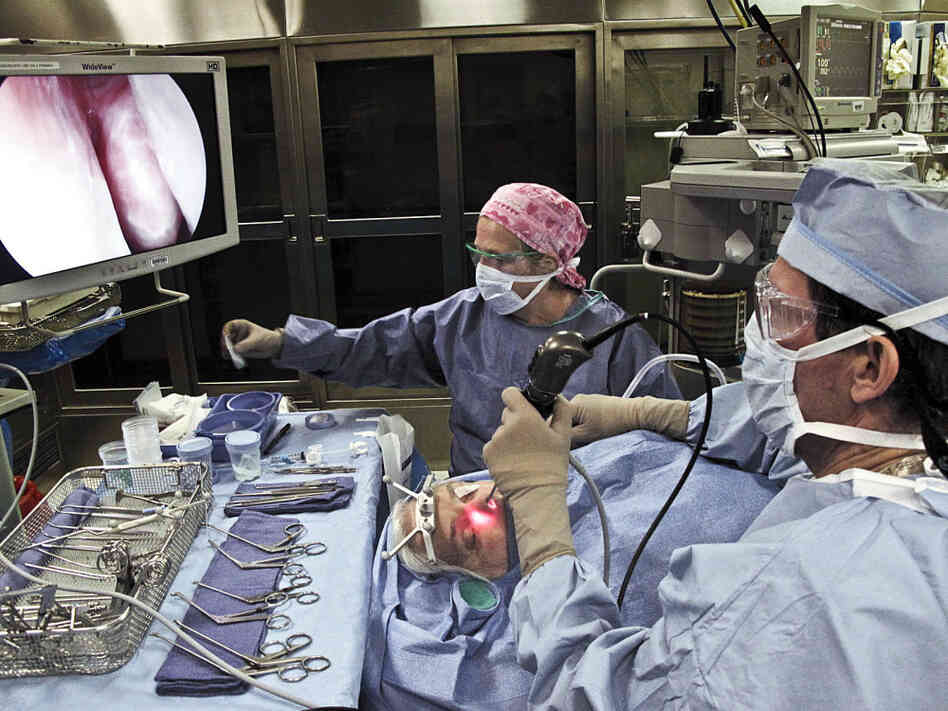 Assisted by scrub nurse Judy Curtis, Dr. Ralph Metson erforms sinus surgery on Nancy Butler. Assisted by scrub nurse Judy Curtis, Dr. Ralph Metson erforms sinus surgery on Nancy Butler.