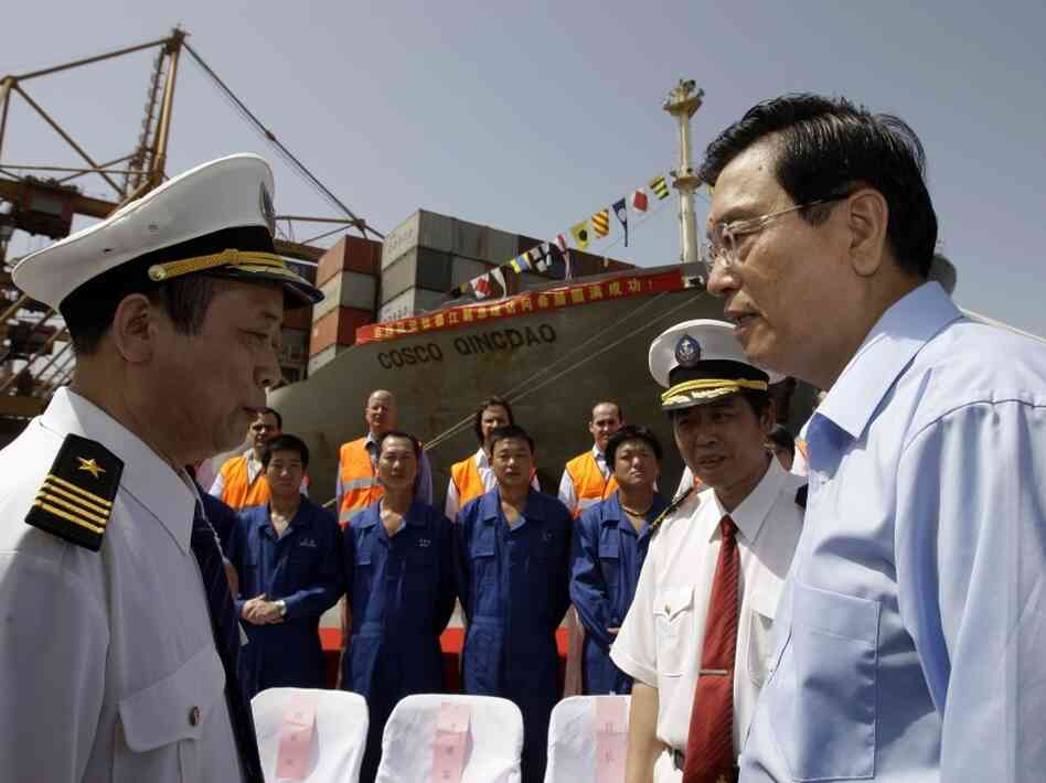Chinese Vice-Premier Zhang Dejiang talks to Cosco employees at the port of Piraeus Chinese Vice-Premier Zhang Dejiang talks to Cosco employees at the port of Piraeus
