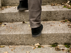 A man walks up stairs. A man walks up stairs.