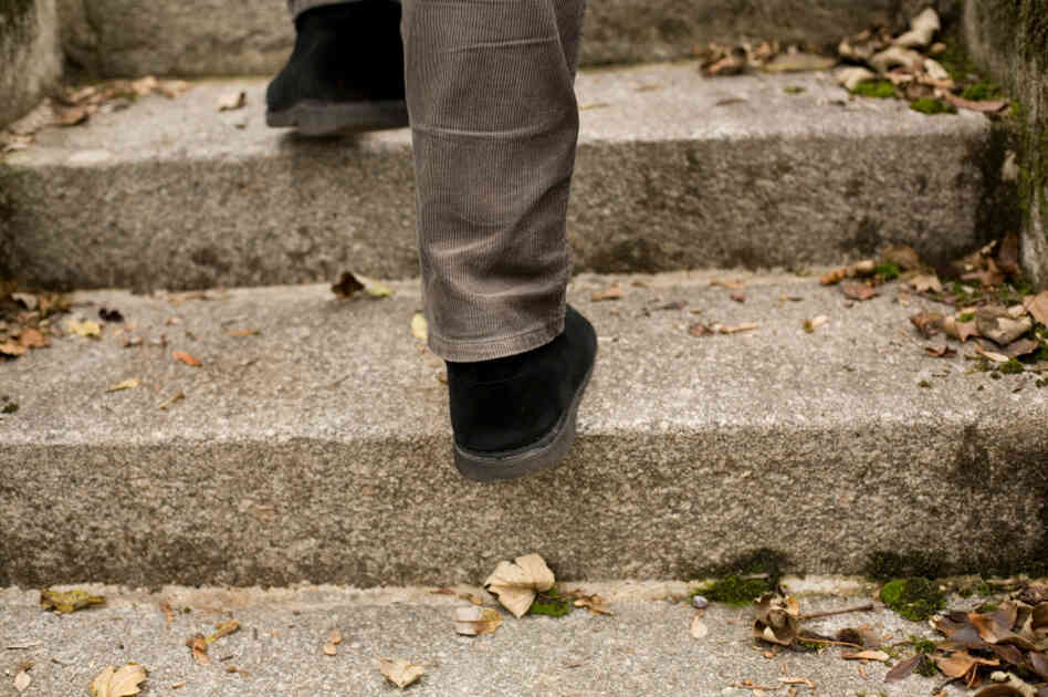 A man walks up stairs. A man walks up stairs.