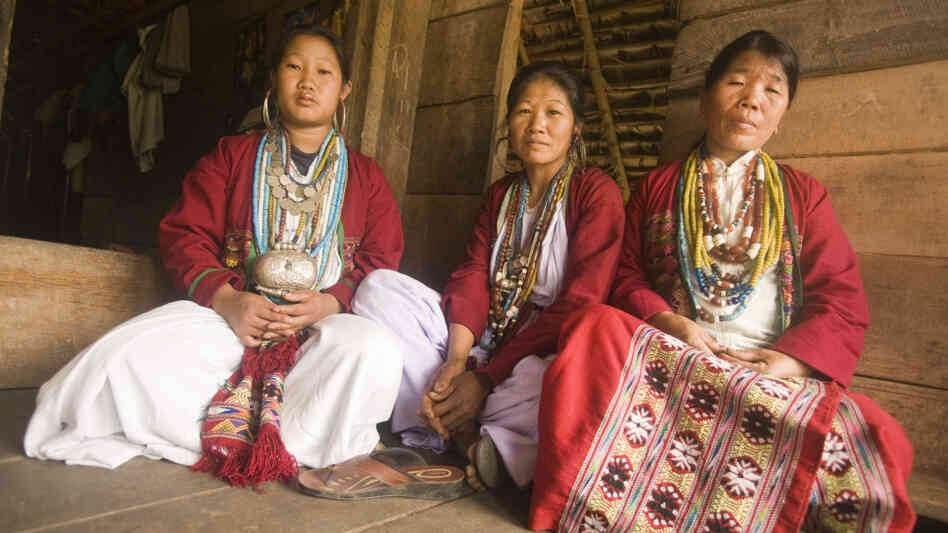 Three speakers of the newly identified language Koro  gather at a house in Kichang village in India.