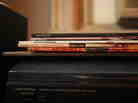LPs on top of a dusty turntable