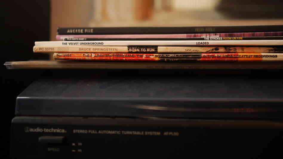 LPs on top of a dusty turntable LPs on top of a dusty turntable