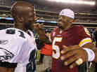 NFL player Donovan McNabb of the Washington Redskins greets Jason Avant of the Philadelphia Eagles.