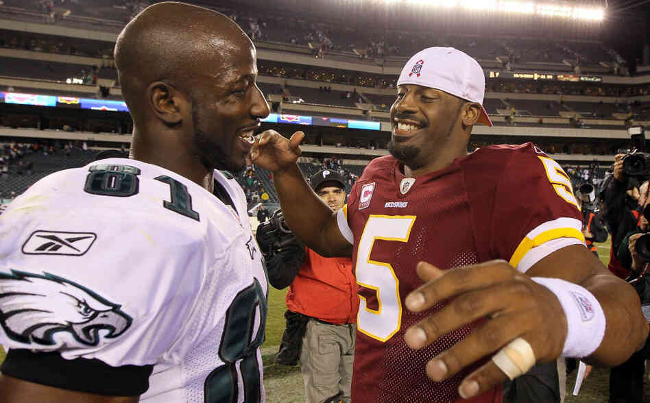 NFL player Donovan McNabb of the Washington Redskins greets Jason Avant of the Philadelphia Eagles. NFL player Donovan McNabb of the Washington Redskins greets Jason Avant of the Philadelphia Eagles.