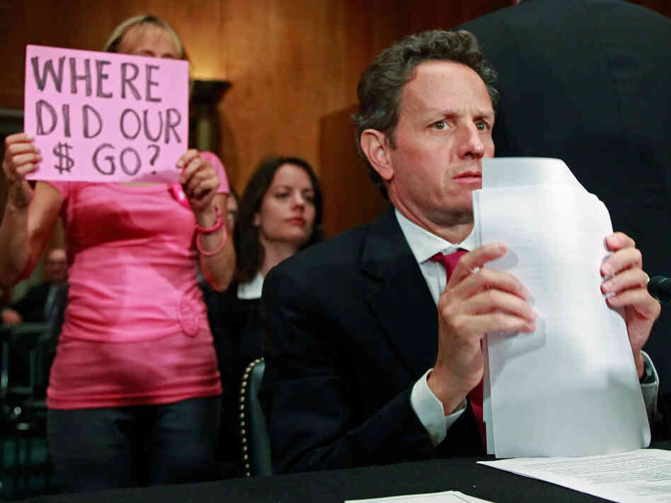 Sept. 10, 2009: A protester holds a sign as Treasury Secretary Timothy Geithner testifies about TARP Sept. 10, 2009: A protester holds a sign as Treasury Secretary Timothy Geithner testifies about TARP