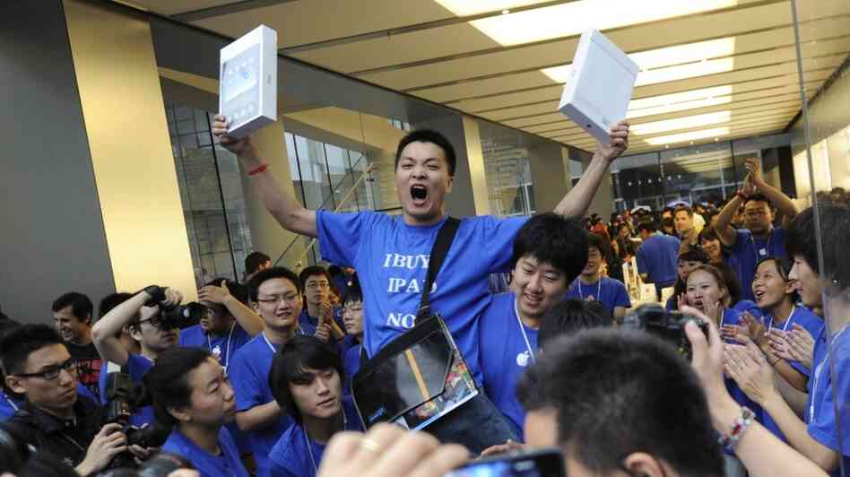 Apple customer Han Ziwen shouts holding Apple customer Han Ziwen shouts holding