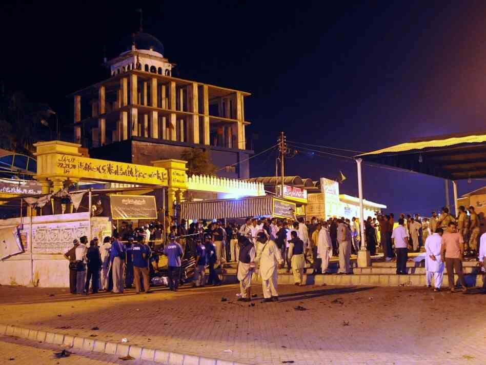 Pakistani security officials collect evi Pakistani security officials collect evi