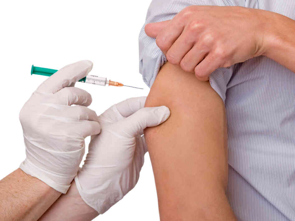 Man gets a flu shot Man gets a flu shot