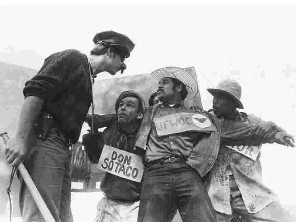 Luis Valdez (center) performing with his theater troupe, El Teatro Campesino, 1966. The troupe staged short plays to promote political awareness. 