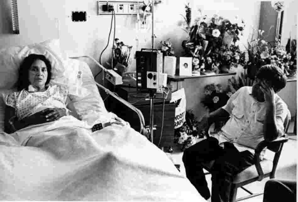 Dolores Huerta was a co-founder of the National Farm Workers Association. Although often in the shadow of Chavez, she was an influential leader. Here, Chavez visits with her in a hospital as she recuperates from a police assault. 