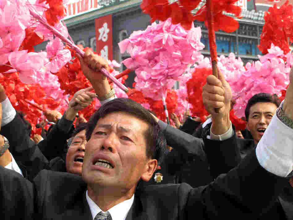 The faithful weep with joy at a rally for their leader, Kim Jong Il, and his son and chosen successor, Kim Jong Un.