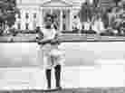 Condoleezza Rice stands in front of the White House as a girl.