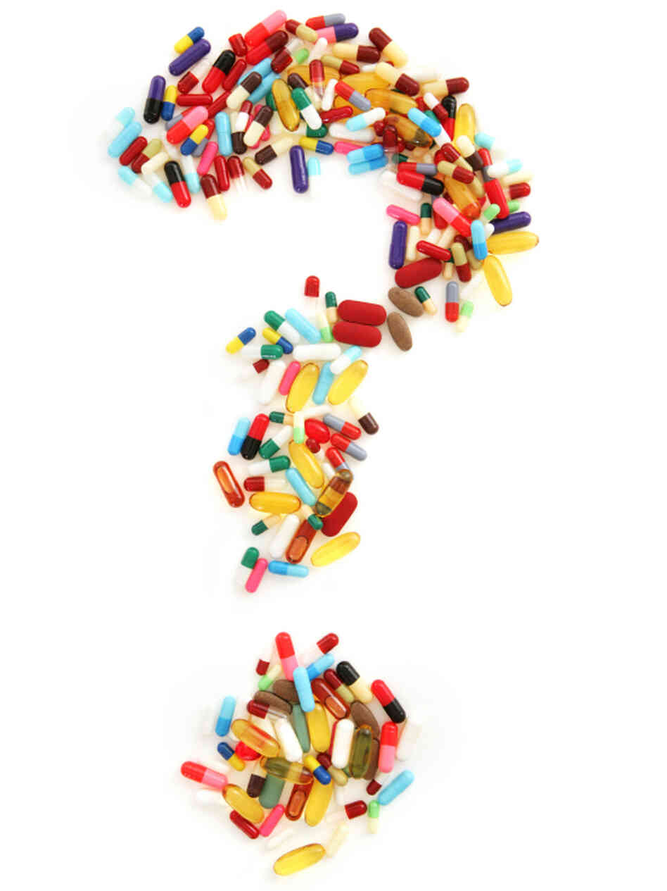 A question mark formed from pills and capsules A question mark formed from pills and capsules