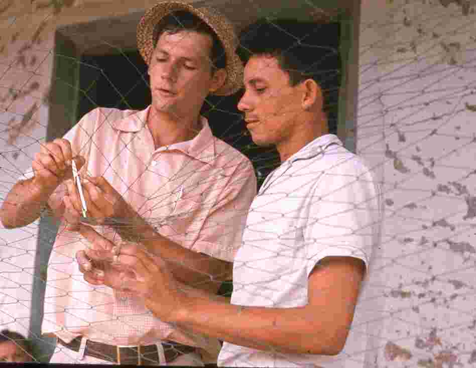 Helping a local fisherman with his nets, Panama, 1969