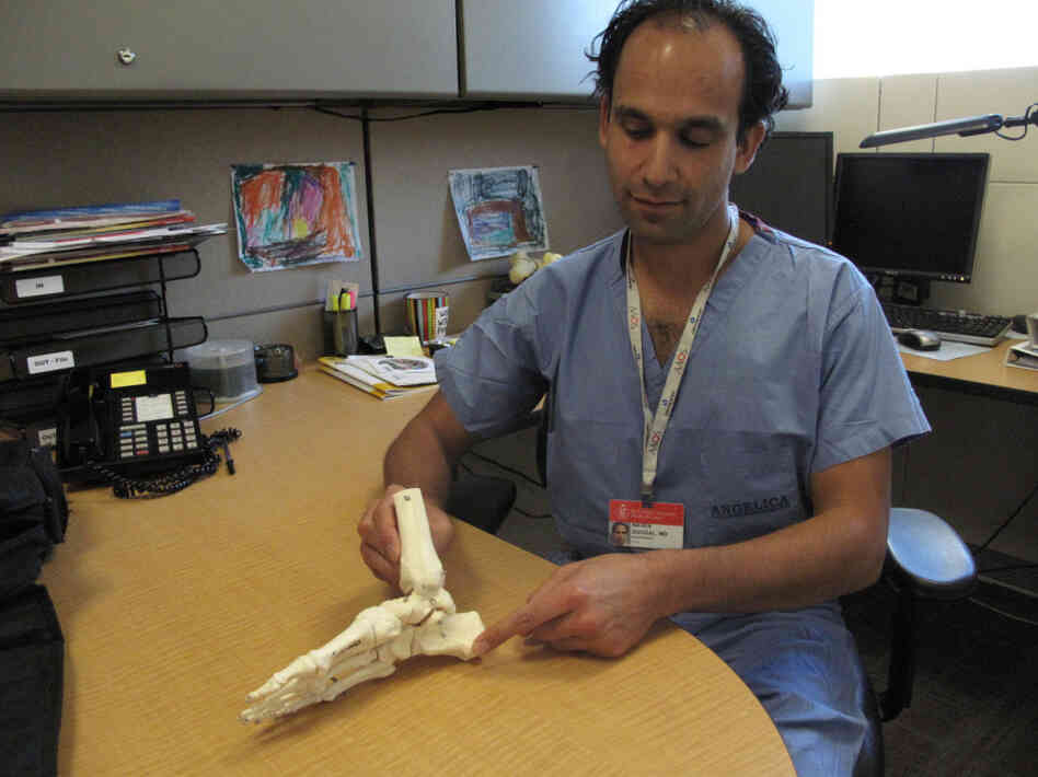 Dr. Naven Duggal shows where the plantar fascia runs, from the heel to the base of the toes Dr. Naven Duggal shows where the plantar fascia runs, from the heel to the base of the toes