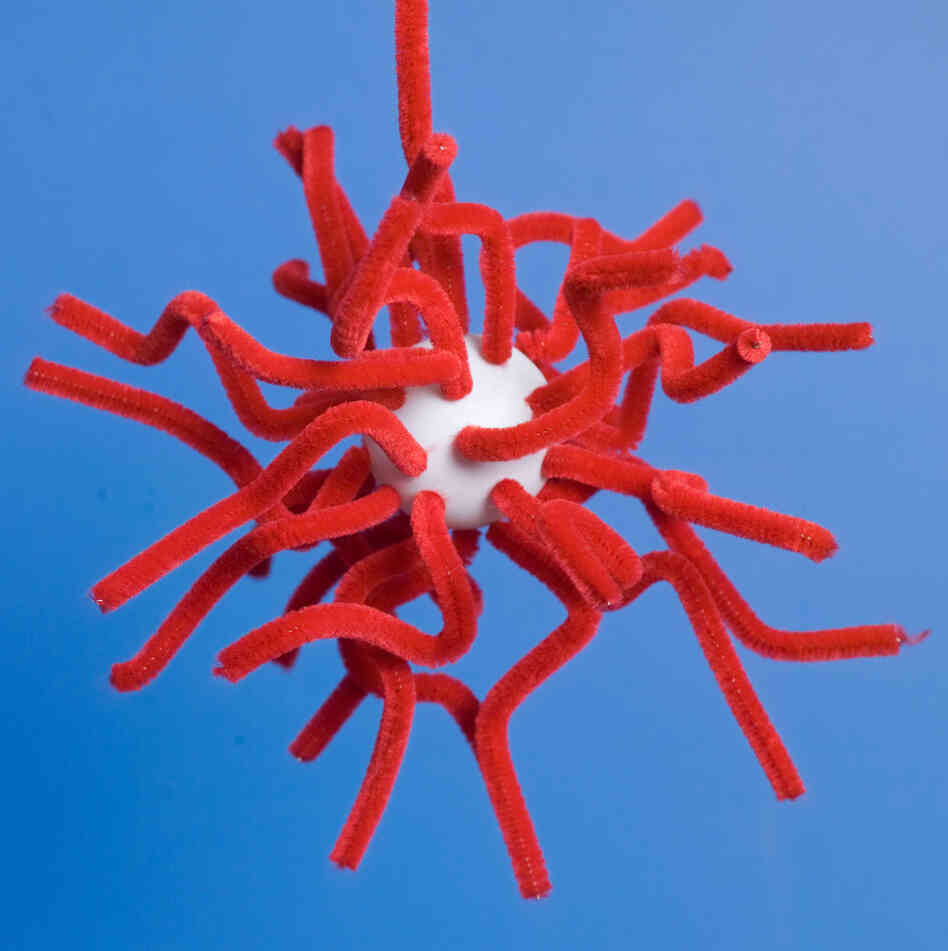 Model of a hairy spherical block copolymer particle