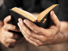 Hands holding a bible. iStockphoto.com Hands holding a bible. iStockphoto.com