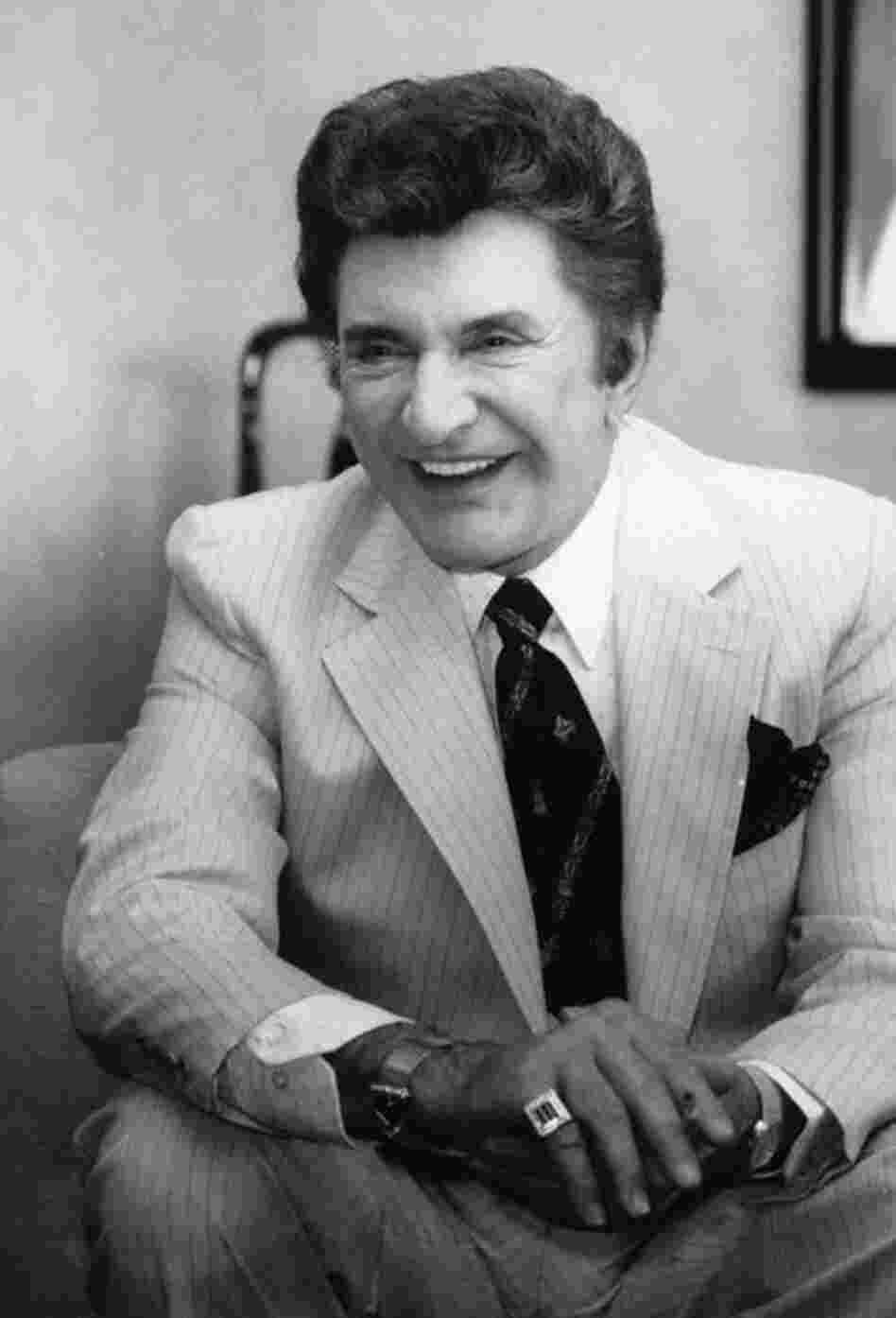 Liberace is interviewed in his hotel room in New York on April 11, 1984, where he is practicing for his two-week performance at Radio City Music Hall.  