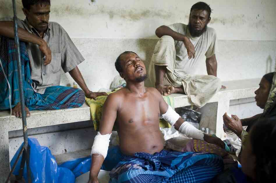 Shabut Malik (center), for example, was attacked while fishing in the jungle. "I started to scream but was silenced when it pounced upon me," he told the photographer. "I tried to stop it by plunging both my hands into his mouth. In the scuffle I fell into the water. ... I stayed underwater as long as I could and when I came up the tiger was gone."