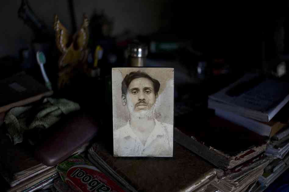 Sushanth Mandal (in the photograph) was killed by a tiger. His brother Bablu continues fishing. "Earning a livelihood here is almost an impossible task," he told the photographer. "The way things are now, with ... the risk of getting attacked by tigers make me shiver. You don't even want to think about it."