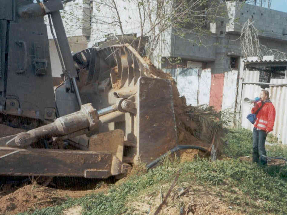 Rachel Corrie, 23, stands in front of a Palestinian's home to prevent it from being demolished Rachel Corrie, 23, stands in front of a Palestinian's home to prevent it from being demolished