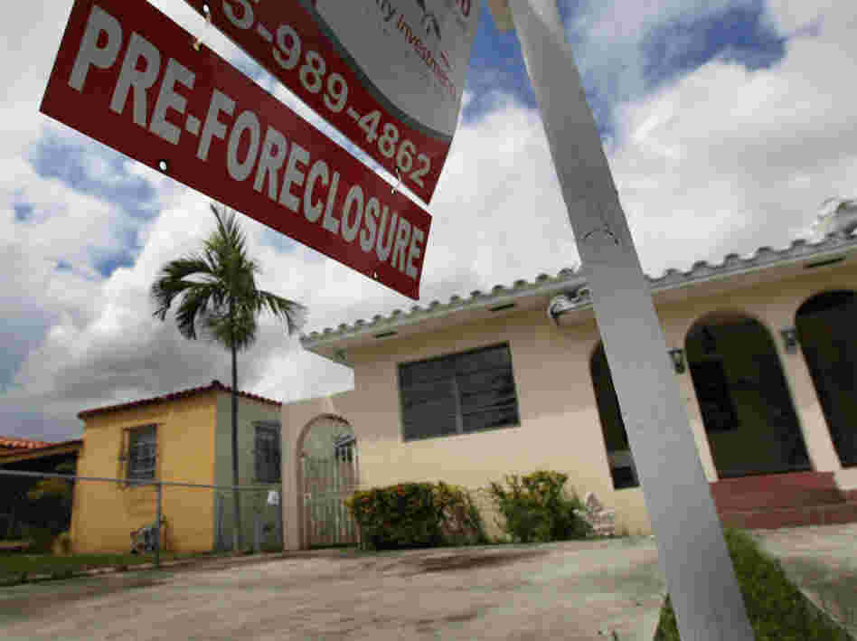 A pre-foreclosure sign hangs in front of a home in Miami, Florida.