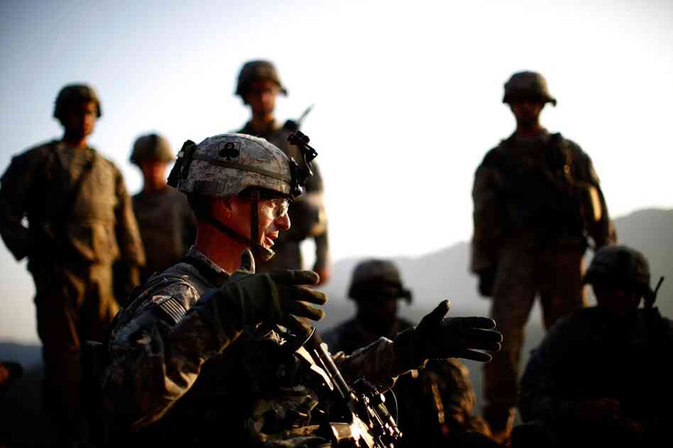 After a U.S. Chinook transport helicopter was disabled Oct. 12 by a grenade near the border, and the 101st U.S. Airborne Division has been summoned to help the survivors, who are engaged in small-arms fire. Lt. Col. Joel Vowell talks to the members of Alpha Co. about their rescue mission.