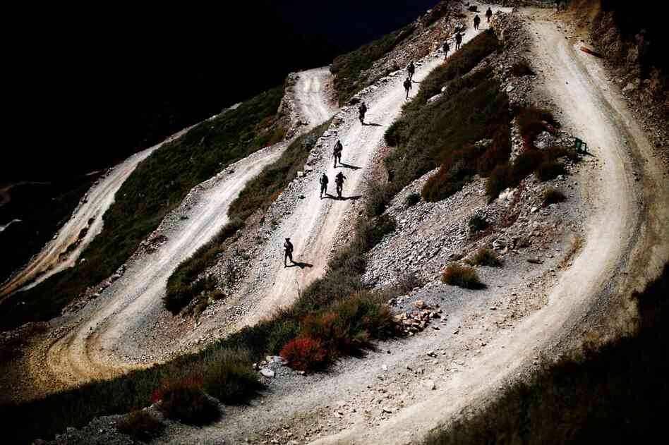 U.S. soldiers on patrol wend their way toward the Pakistan border. It appears that whoever was occupying the abandoned compounds left in a hurry.