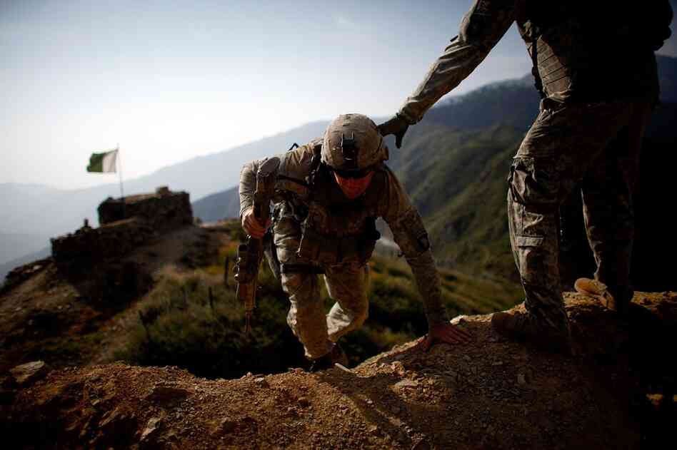 U.S. soldiers on patrol in Kunar province climb the hills and footpaths near the Pakistan border. Whoever left the compound, about two weeks ago, left this part of the border unprotected, with no explanation to the soldiers here as to why they pulled out without waiting for replacements.