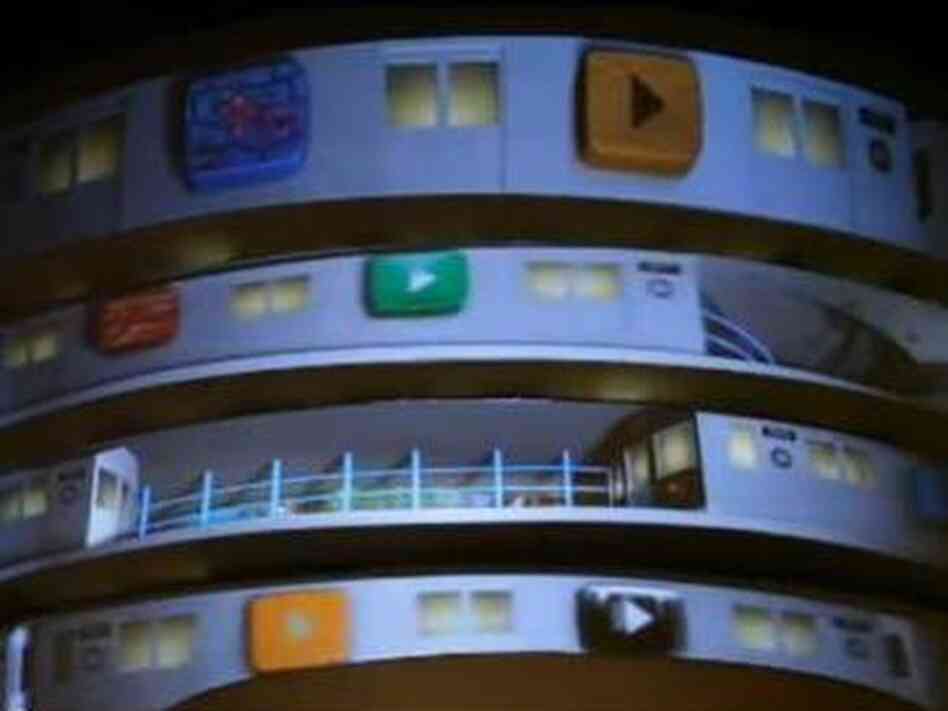 Screengrab shows play buttons projected on the walls of the Guggenheim Museum in New York City. Screengrab shows play buttons projected on the walls of the Guggenheim Museum in New York City.