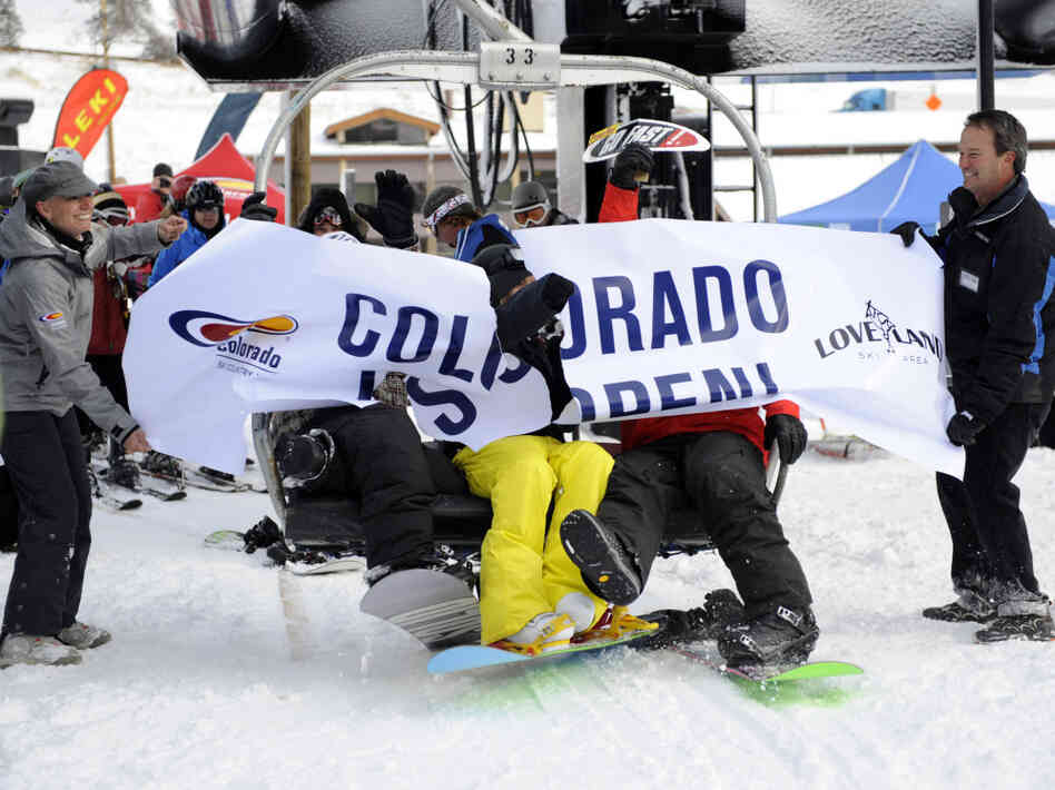 Skiers get off a chairlift for the first day of skiing at Loveland Ski Area. Skiers get off a chairlift for the first day of skiing at Loveland Ski Area.