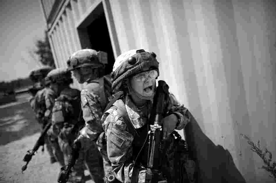 Soldiers yell for help after "enemy" fighters shoot at their patrol during a mock combat exercise. The Army has changed the way it trains new recruits. For the first time in 30 years, gone are the bayonets and long runs, replaced with  core exercises and sprints.