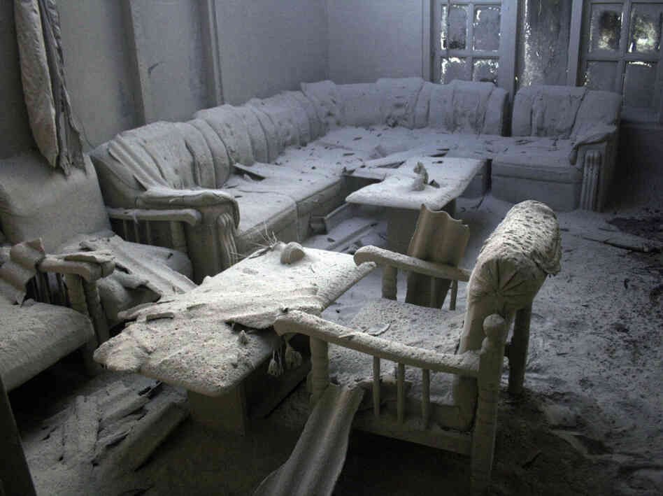 Furniture is covered by volcanic ash in a house in a village badly hit by the eruption of Mount Mera Furniture is covered by volcanic ash in a house in a village badly hit by the eruption of Mount Mera