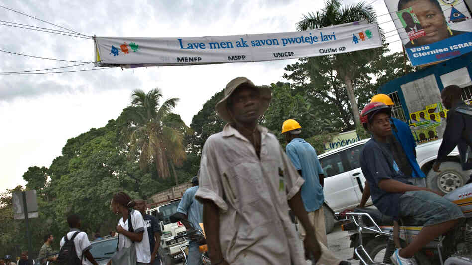 A banner in Port-au-Prince urges people to wash with soap A banner in Port-au-Prince urges people to wash with soap